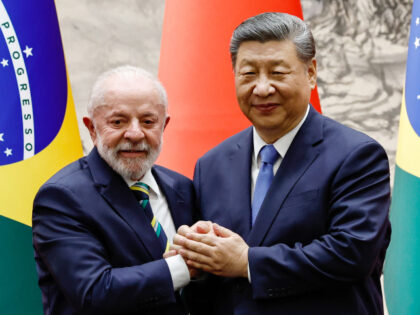 Chinese President Xi Jinping shakes hands with Brazil's President Luiz Inacio Lula da