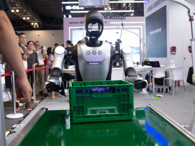 New Economy Based on Robotics A humanoid robot works on an assembly line at the Shanghai New Expo Center during the Worl