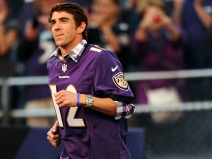 BALTIMORE, MD - SEPTEMBER 10: U.S. Olympian Michael Phelps runs on the field with the Balt