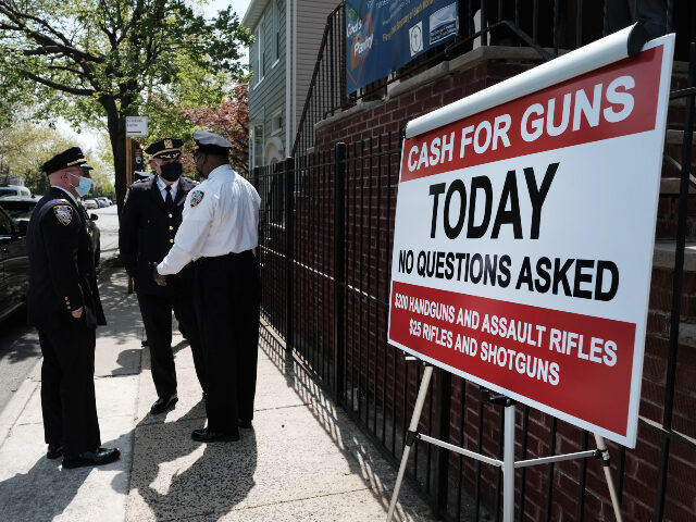 A sign advertises a gun buy-back event at a church in Staten Island on April 24, 2021 in N