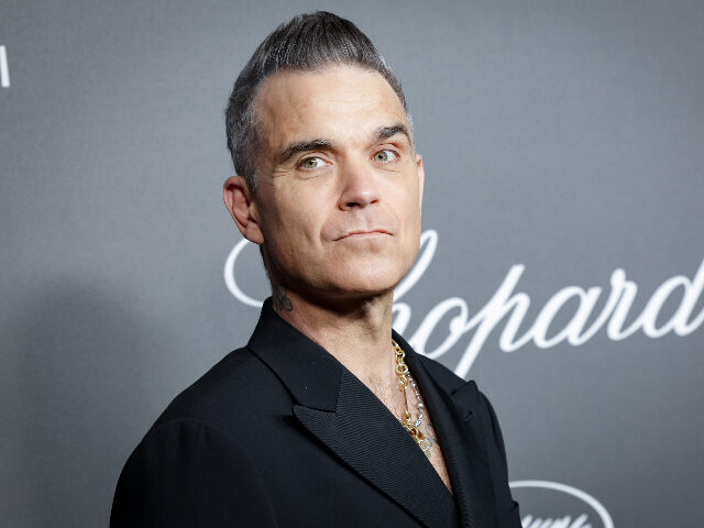 RobbieWilliams CANNES, FRANCE - MAY 23: Robbie Williams attends Chopard ART Evening at the Martinez on Ma