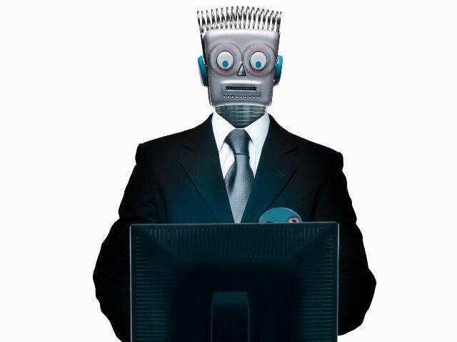 Robot typing on computer