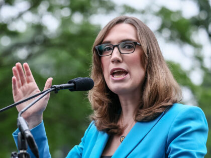 U.S. Rep Sarah McBride speaks during a rally opposing House Republicans Tax Proposal prior