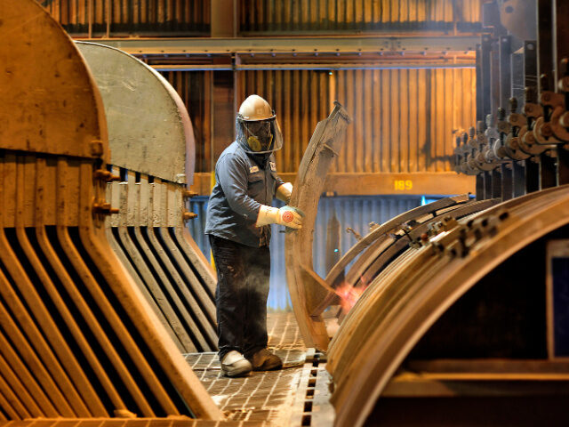 Alcoa Inc. employee Jerry Rivers opens an electrolytic cell to change the carbon anode at