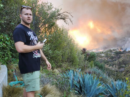 PACIFIC PALISADES, CA - JANUARY 7: Spencer Pratt is seen in watching the wildfire as it ap
