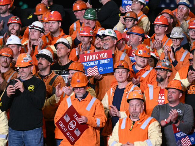 Steel Workers Thank President Trump A steel worker holds a sign as US President Donald Trump speaks during a visit to US Steel