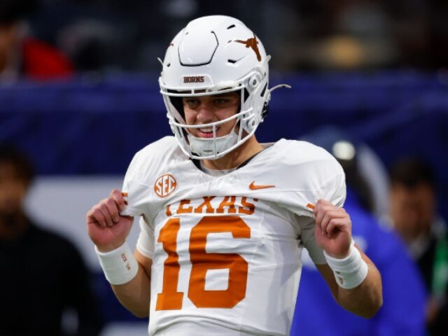 ATLANTA, GEORGIA - DECEMBER 7: Arch Manning #16 of the Texas Longhorns warms up prior to t