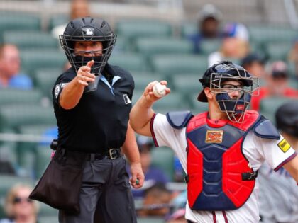 ATLANTA, GEORGIA - AUGUST 10: Umpire Jen Pawol calls a strike during the fourth inning of