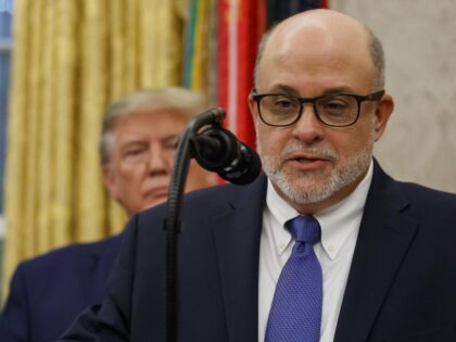 Mark Levin speaks, with President Donald Trump behind him, during a ceremony to present th