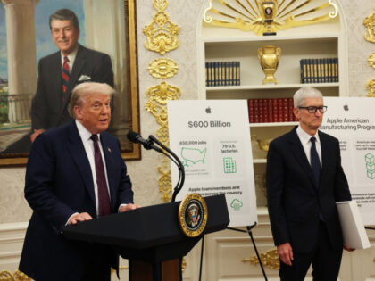 U.S. President Donald Trump speaks during an event with Apple CEO Tim Cook (R) in the Oval