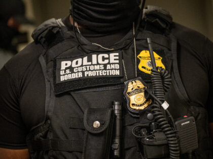 A US Customs and Border Protection agent outside of immigration court rooms at the Jacob K