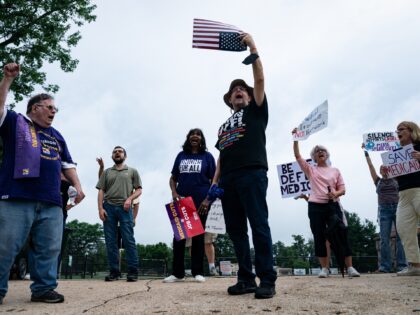 Demonstrators prior to a campaign event with Winsome Earle-Sears, Republican gubernatorial