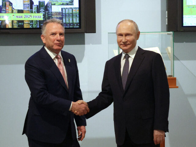 n this pool photograph distributed by the Russian state agency Sputnik, Russia's Pres