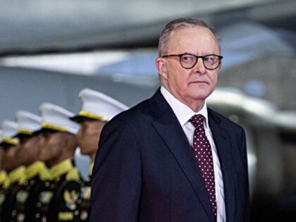 Australia's Prime Minister Anthony Albanese (2nd L) walks upon his arrival at Halim Perdan