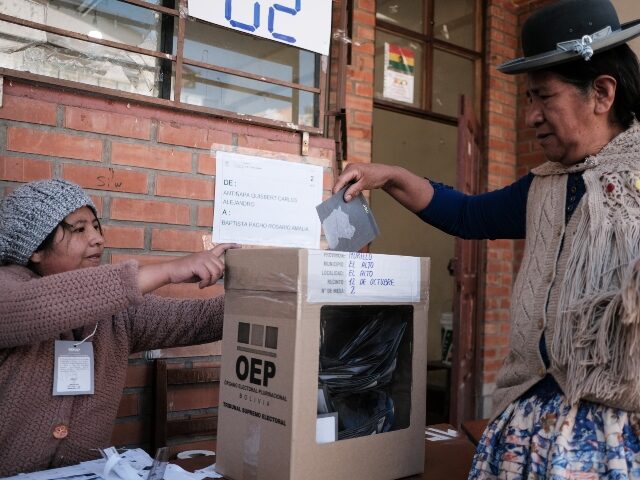 LA PAZ, BOLIVIA - AUGUST 17: A woman casts her vote during the presidential elections in L