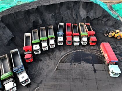 LIANYUNGANG, CHINA - JULY 13, 2025 - Trucks are transferring thermal coal unloaded from ca