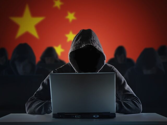 Many chinese hackers in troll farm. Privacy and security concept. vchal/ iStock / Getty Images Plus