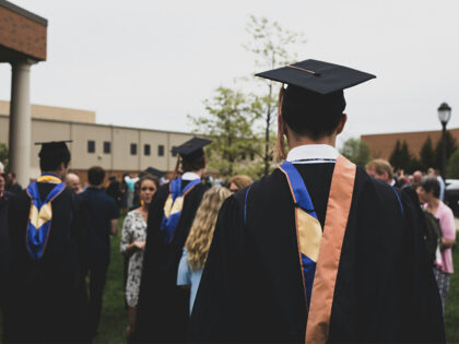 man wearing academic gown Graduation.