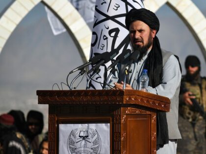 The commander of the Taliban army Qari Fasihuddin speaks during a flag hoisting ceremony o