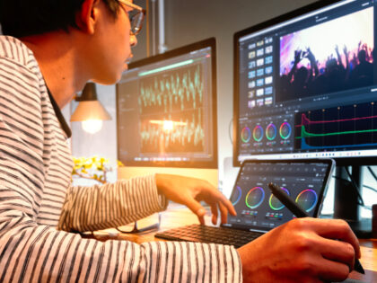 Filmmaker or movie video editor and colorist, working with footage or video on his persona