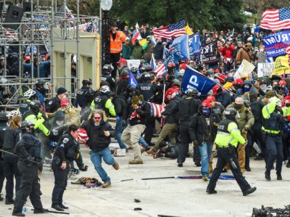 Trump supporters clash with police and security forces as they storm the US Capitol in Was