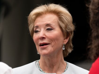 Education Secretary Linda McMahon, talks to her staff as they wait on the North Lawn of th