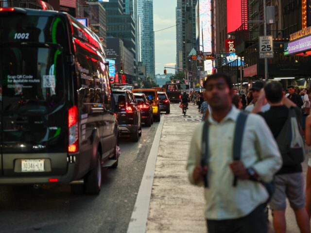 manahattan earthquake NEW YORK, NEW YORK - JULY 12: People take photographs of the sunset at 42nd Street in Time