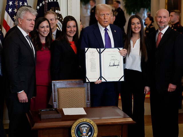 WASHINGTON, DC - JANUARY 29: Surrounded by members of Congress and the family of Laken Ril