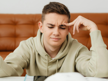 Close-Up Shot of a Boy Thinking