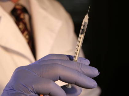 Doctor Holding Syringe