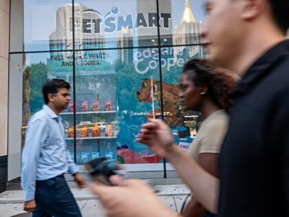 NEW YORK CITY - AUGUST 12: People walk by a pet retail store in Manhattan on August 12, 20