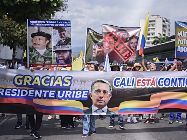 CALI, COLOMBIA - AUGUST 07: Supporters and opponents of former President Alvaro Uribe clas