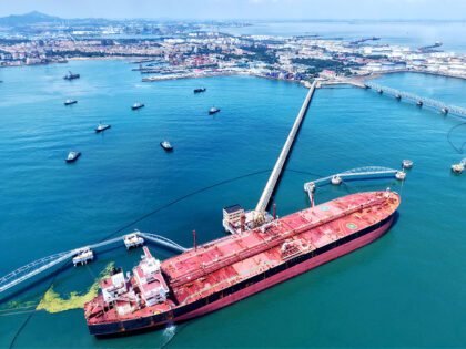 A tanker unloads imported crude oil at the Qingdao Port crude oil terminal in Qingdao, Sha