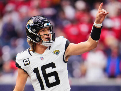 HOUSTON, TX - NOVEMBER 26: Trevor Lawrence #16 of the Jacksonville Jaguars celebrates afte