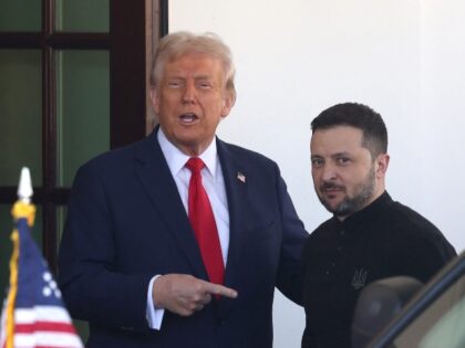 US President Donald Trump greets Ukraine's President Volodymyr Zelensky as he arrives