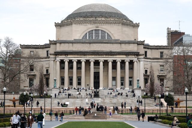 An image shows students on the campus of Columbia University, which reached a $200 million