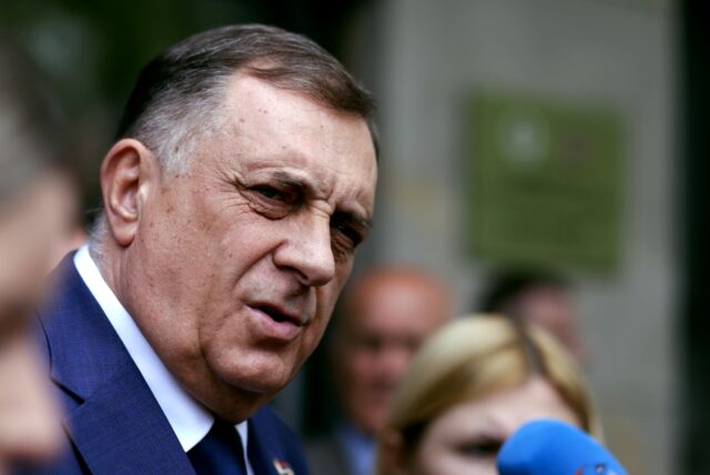 The Bosnian Serb president, Milorad Dodik, is defying a ban on him staying in office, and