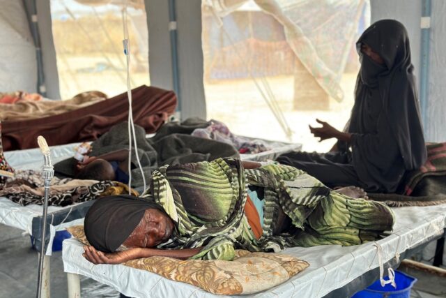 Cholera patients receive treatment in an isolation tent in a displaced persons' camp