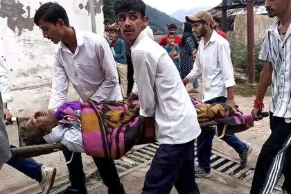 Crowds gathered at a Kishtwar hospital while people carried some of the injured on stretch