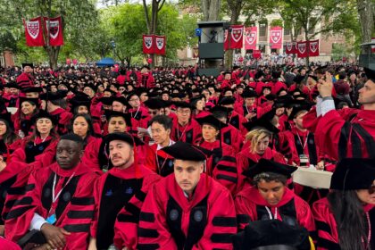 Graduates gather as they attend commencement ceremony at Harvard University in Cambridge,