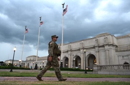 A member of the DC National Guard patrols outside Union Station in Washington, DC, on Augu