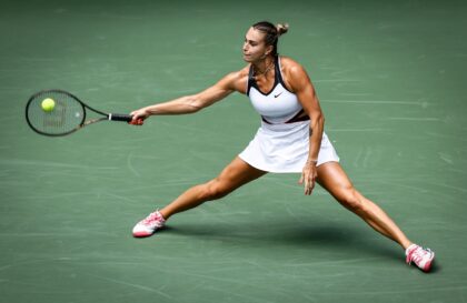 World number one and reigning champion Aryna Sabalenka stretches to return in her US Open