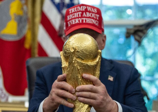 US President Donald Trump holds the World Cup trophy -- he announced the 2026 World Cup dr