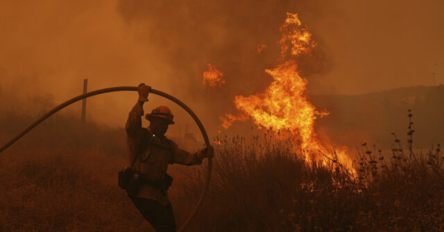 Fast-growing brush fire forces thousands to evacuate north of Los ...