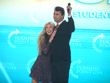 Erika & Charlie Kirk. Charlie Kirk speaking with attendees at the 2021 Student Action