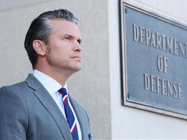 9-22-25-Secretary-of-War-Pete-Hegseth-gettyimages ARLINGTON, VIRGINIA - SEPTEMBER 22: U.S. Secretary of War Pete Hegseth stands at attention