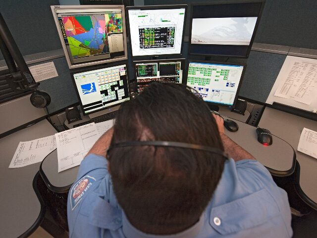 911 Dispatcher at his station