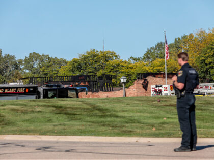 GRAND BLANC, MICHIGAN - SEPTEMBER 28: The burned church as emergency services respond to a