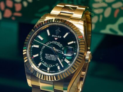 A gold Rolex Sky-Dweller watch, right, displayed in the window of a Bucherer AG luxury wat