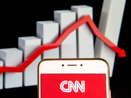 In this photo illustration, the CNN logo is seen displayed on an Android mobile device wit